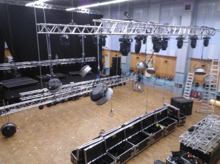 Truss and lighting rig build ahead of a show