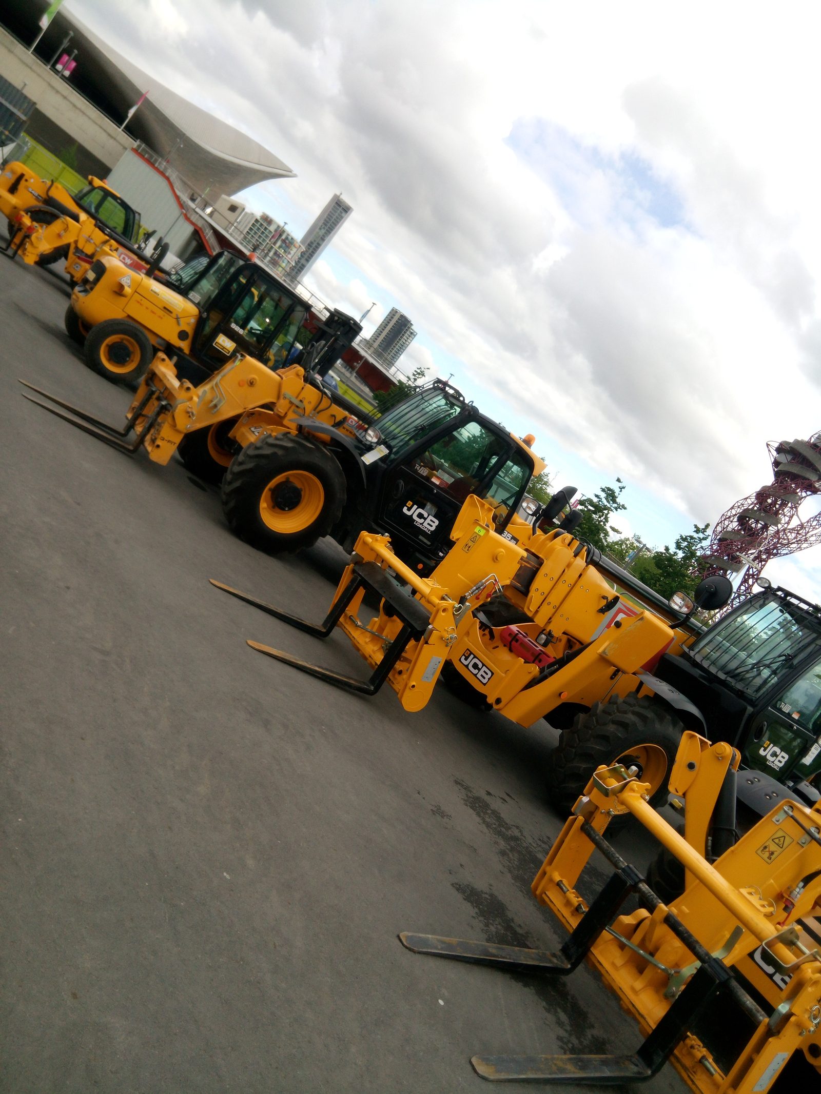 JCB telehandlers lined up on site
