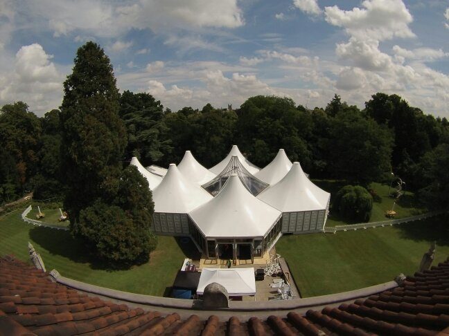 Aerial view of a peaked marquee structure on an estate lawn
