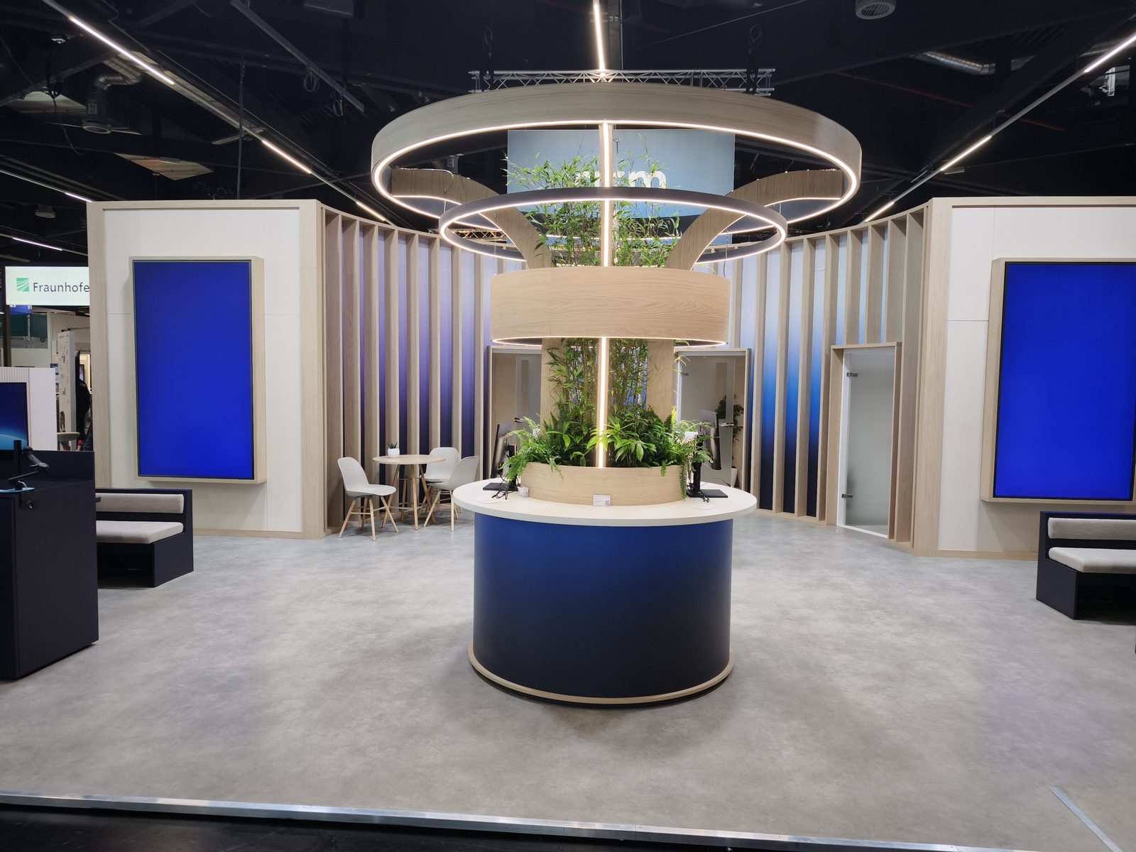 Exhibition stand build with branded video screens