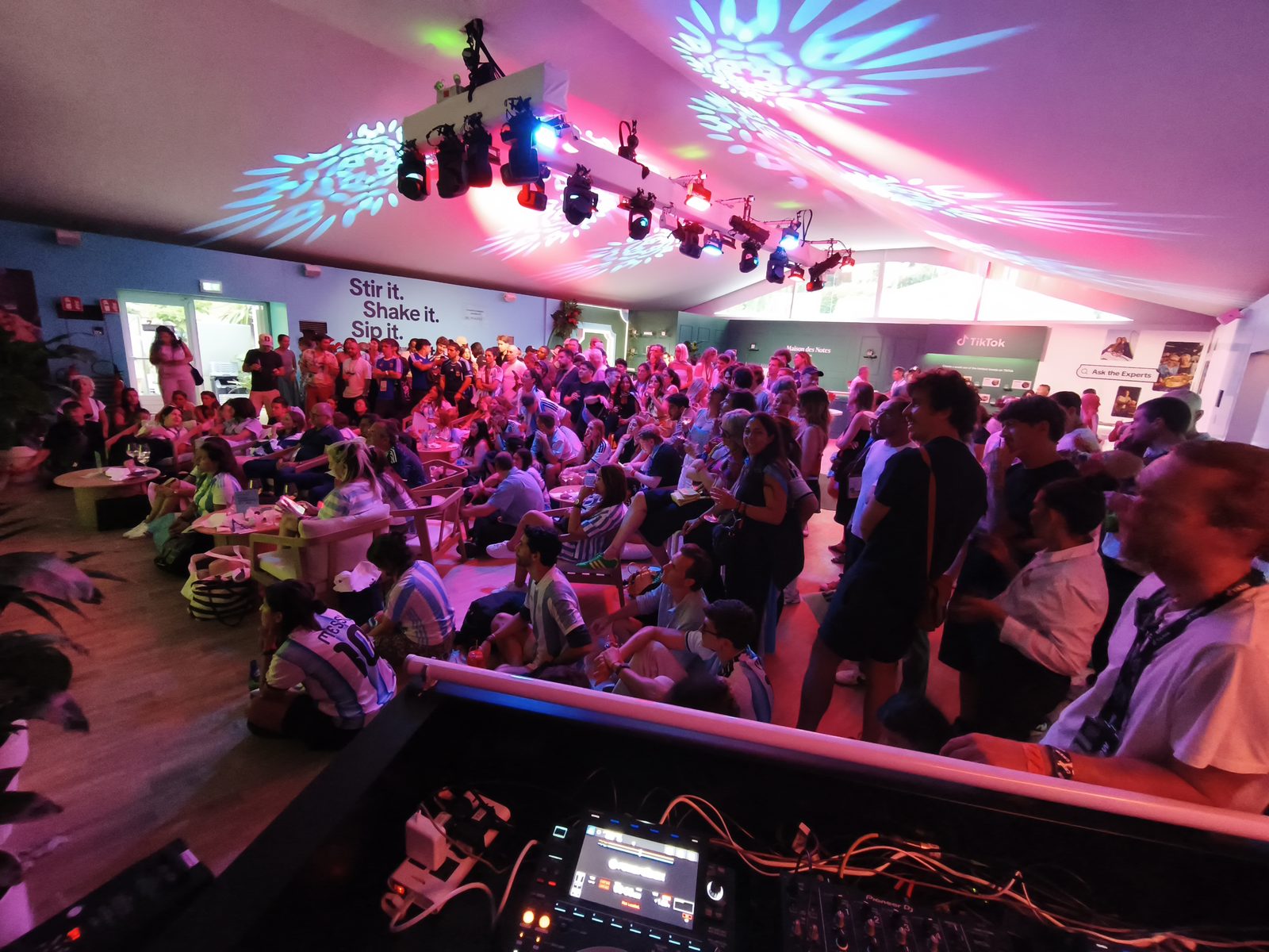 Branded lounge event with moving-head lighting and crowd